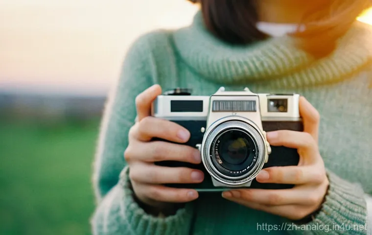 아날로그 기술의 현재 - **Prompt for Film Camera:**
    "A person, wearing warm, vintage-inspired everyday clothing like a c...